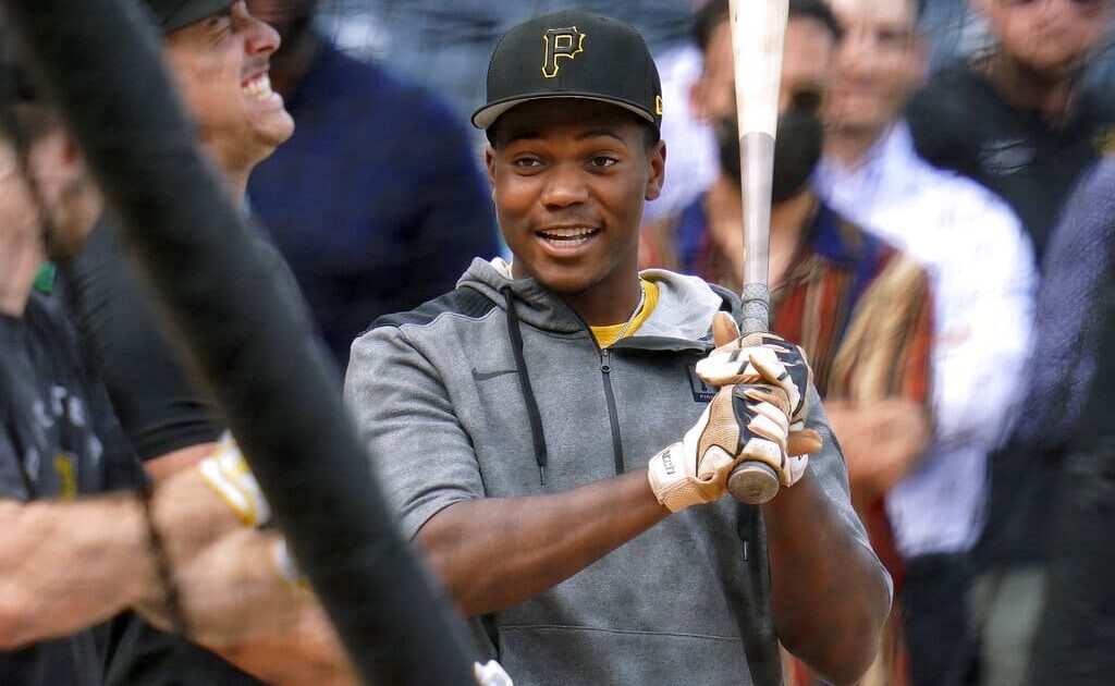 Pittsburgh Pirates first-round draft selection Termarr Johnson waits his turn in the batting cage after signing his contract with the team, before the Pirates' baseball game against the Philadelphia Phillies in Pittsburgh, Friday, July 29, 2022.(AP Photo/Gene J. Puskar)