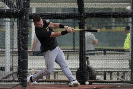 Pittsburgh Pirates catcher Henry Davis hits in the batting cage during a baseball spring training workout Saturday, Feb. 17, 2024, in Bradenton, Fla. (AP Photo/Charlie Neibergall)
