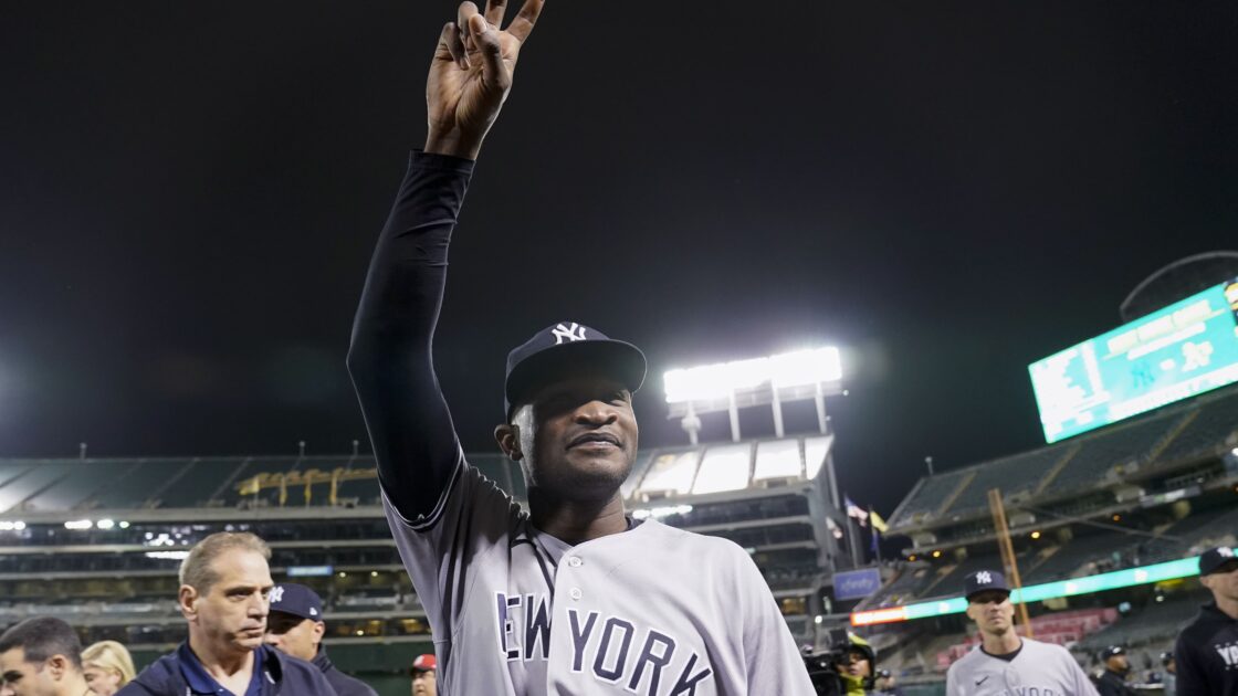 New York Yankees pitcher Domingo Germán, center, walks off the field after his perfect game against the Oakland Athletics in a baseball game in Oakland, Calif., Wednesday, June 28, 2023. (AP Photo/Godofredo A. Vásquez)