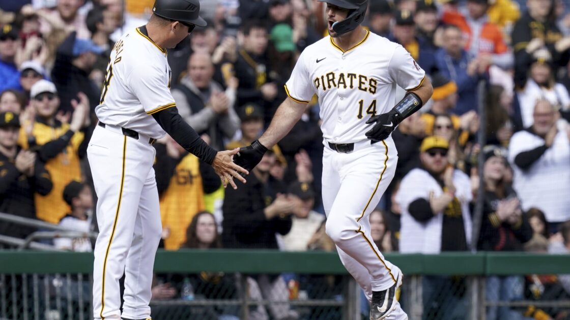Pittsburgh Pirates' Joey Bart, right, is greeted by third base coach Mike Rabelo, left, after hitting a home run during the second inning of a baseball game against the Baltimore Orioles, Saturday, April 6, 2024, in Pittsburgh. (AP Photo/Matt Freed)